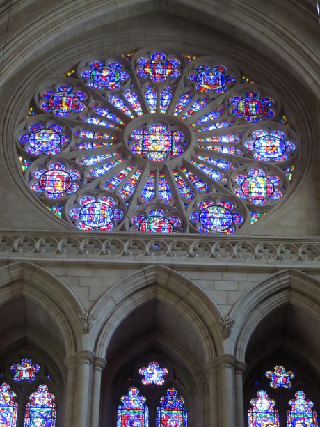 Another window from the National Cathedral, this reminds us quilters immediately of a Dresden Plate pattern. 